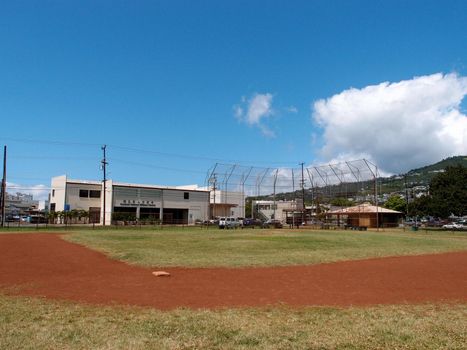 Empty Baseball Field at Mo'Ili'Ili Neighborhood Park on a beautiful day on Oahu, Hawaii.