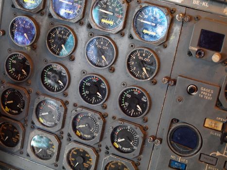 Jet aircraft cockpit Equipment with various indicators, buttons, dials, and instruments.