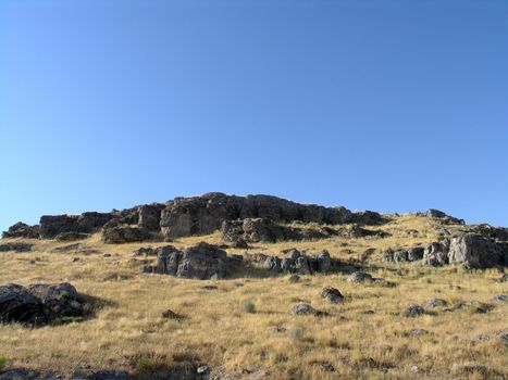 Rocky Hillside with tall dry grass in Utah.