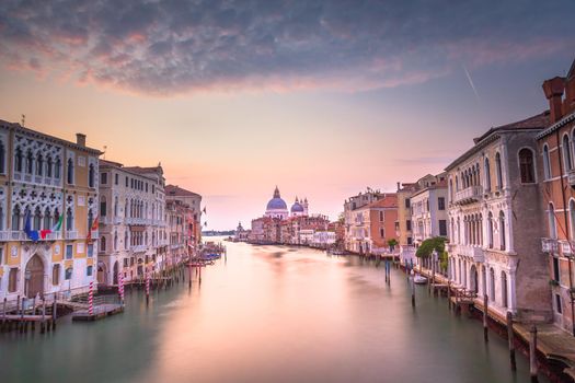 Grand Canal of Venice with Santa Maria della Salute Cathedral and blurred movement due to long Exposure.