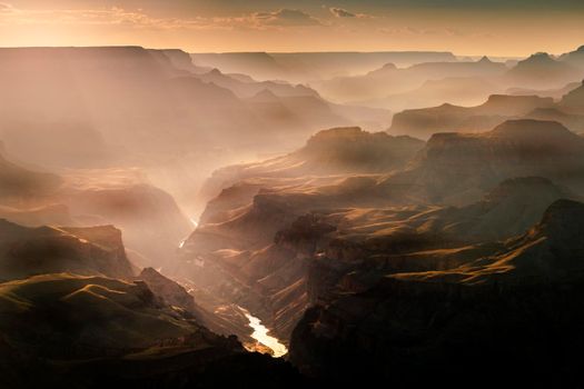 Grand Canyon south rim at golden sunset with Colorado River, Arizona, United States.