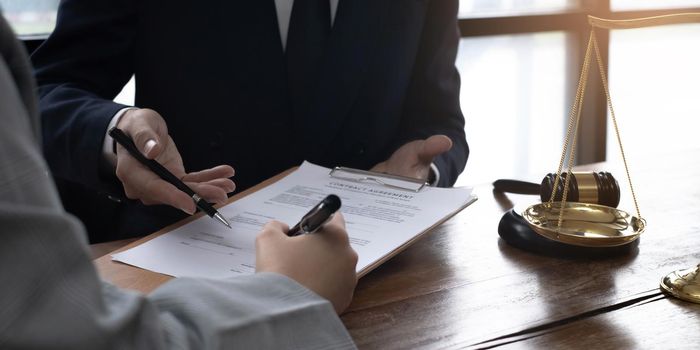 Group of business people and lawyers discussing contract papers ,Consultation between a male lawyer and businessman concept.