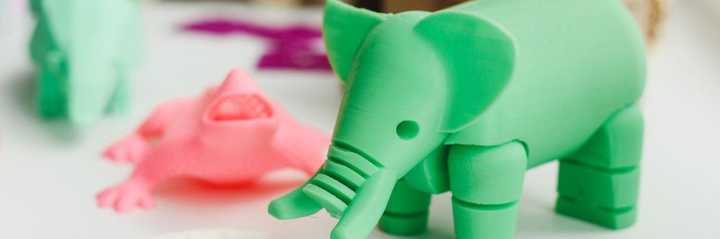 3D figures printed on an elephant, lizard, and snail printer. 3d toys for children. Web banner.