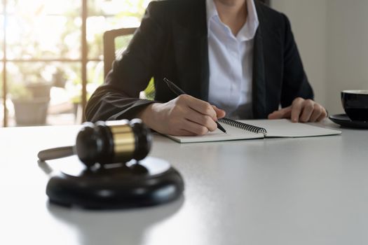 Judge gavel with Justice lawyers, Business woam in suit or lawyer working on a documents. Legal law, advice and justice concept