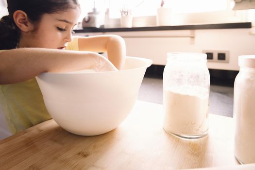 little girl making homemade bread dough, healthy food concept at home