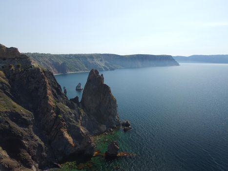 Aerial panoramic view of beautiful sunset above sea. Beautiful seascape. Sun glare, small waves on the water surface. Evening. Horizon. Nobody. No people. Copy space. Never-ending beauty of nature