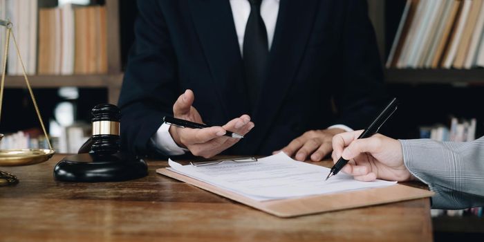 Group of business people and lawyers discussing contract papers ,Consultation between a male lawyer and businessman concept.