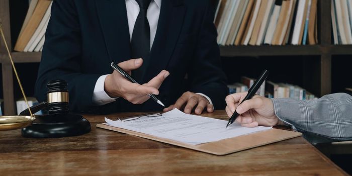 Group of business people and lawyers discussing contract papers ,Consultation between a male lawyer and businessman concept.