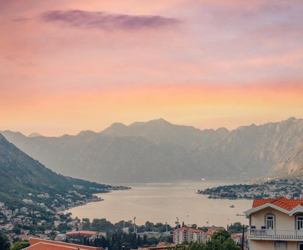 Sunset, beautiful landscape with silhouettes of trees. Travel concept. Montenegro, Kotor Bay. Sunset at Kotor Bay Montenegro. View of the sunset in Boko-Kotor Bay in Montenegro.