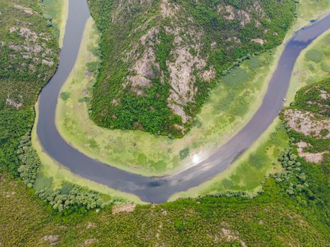 Canyon of Rijeka Crnojevica river near the Skadar lake coast. One of the most famous views of Montenegro. River makes a turn between the mountains and flows backward.