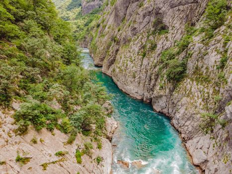 The purest waters of the turquoise color of the river Moraca flowing among the canyons. Travel around Montenegro concept.