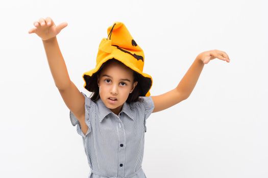 little girl in a witch hat. halloween