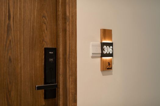 Hotel room number mounted on a wall