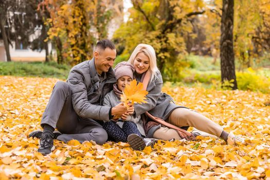 Portrait of family during the autumn.