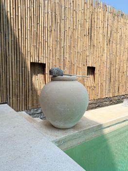 Beautiful clay pottery big water jar near a swimming pool design decoration for washing hand
