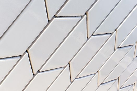 Angled white tile pattern perspective close up background