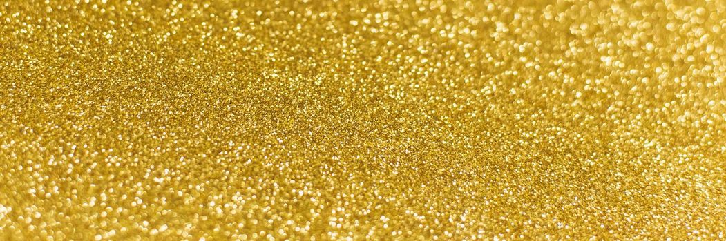 Golden shiny background. gold glitter texture christmas abstract background. Web banner.