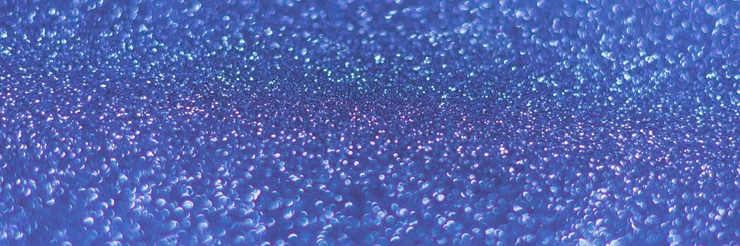Blue shiny background with sparkles. Abstract holiday background. Web banner.