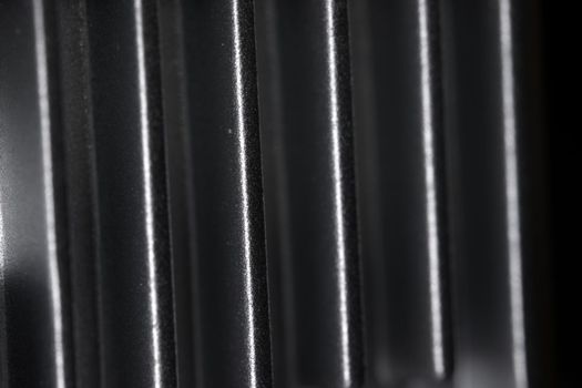 Abstract metal texture detail from the cooling fins of a drone gimbal heat sink. Aluminum or aluminium in material. Full frame abstract background.