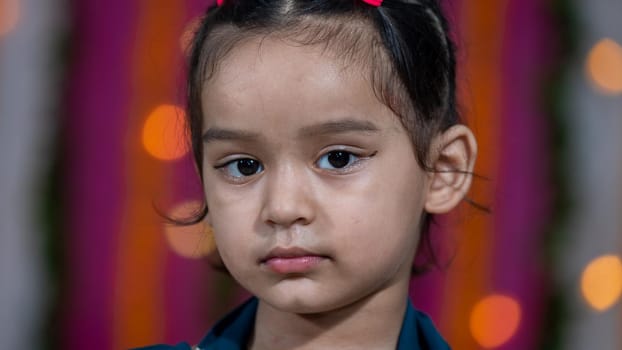 Indian children wearing ethnic Indian dress during Raksha Bandhan, a festival to celebrate the bond between brother-sister. Decoration in Indian houses.