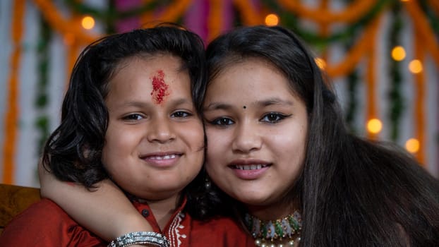 Indian children wearing ethnic Indian dress during Raksha Bandhan, a festival to celebrate the bond between brother-sister. Decoration in Indian houses.