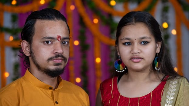 Indian children wearing ethnic Indian dress during Raksha Bandhan, a festival to celebrate the bond between brother-sister. Decoration in Indian houses.