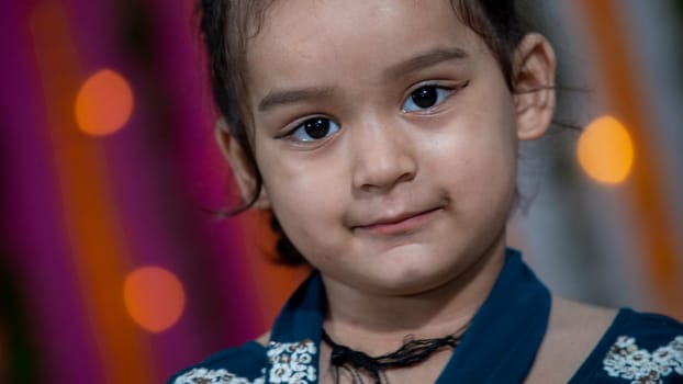 Indian children wearing ethnic Indian dress during Raksha Bandhan, a festival to celebrate the bond between brother-sister. Decoration in Indian houses.