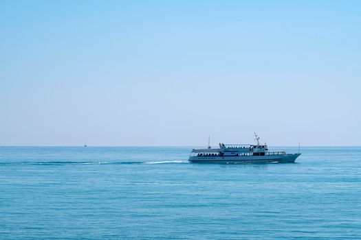 the ship is moving along the horizon of the sea. High quality 4k footage