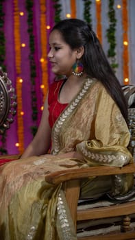 Indian children wearing ethnic Indian dress during Raksha Bandhan, a festival to celebrate the bond between brother-sister. Decoration in Indian houses.