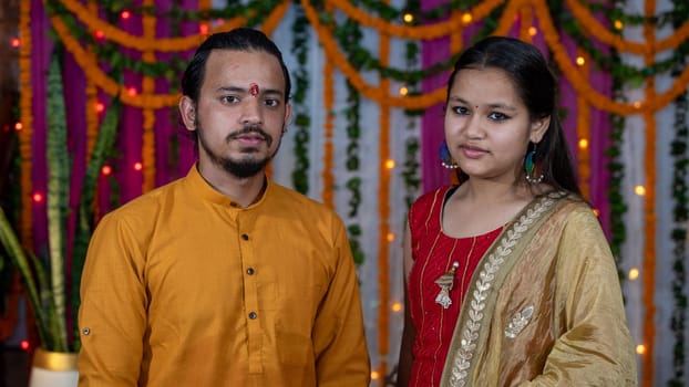 Indian children wearing ethnic Indian dress during Raksha Bandhan, a festival to celebrate the bond between brother-sister. Decoration in Indian houses.