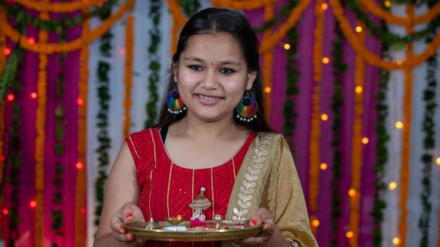 Indian children wearing ethnic Indian dress during Raksha Bandhan, a festival to celebrate the bond between brother-sister. Decoration in Indian houses.