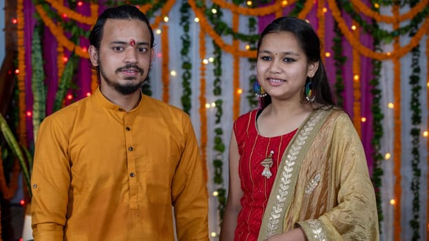 Indian children wearing ethnic Indian dress during Raksha Bandhan, a festival to celebrate the bond between brother-sister. Decoration in Indian houses.