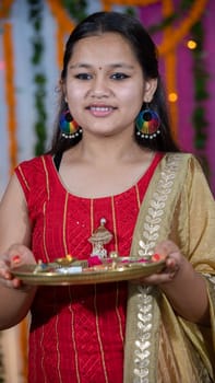 Indian children wearing ethnic Indian dress during Raksha Bandhan, a festival to celebrate the bond between brother-sister. Decoration in Indian houses.