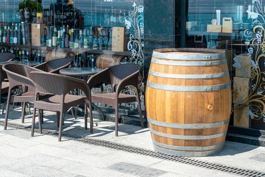 cafe tables with an oak wine barrel. High quality photo