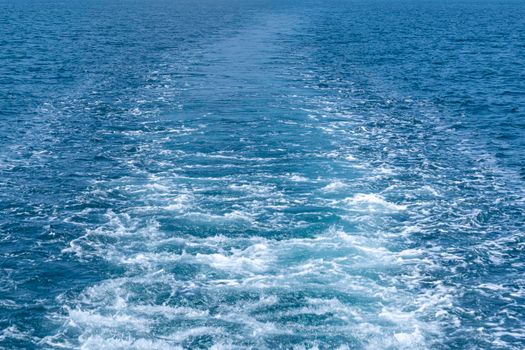 the trace of the ship's propeller on the water. High quality photo