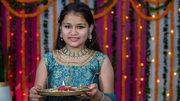 Indian children wearing ethnic Indian dress during Raksha Bandhan, a festival to celebrate the bond between brother-sister. Decoration in Indian houses.