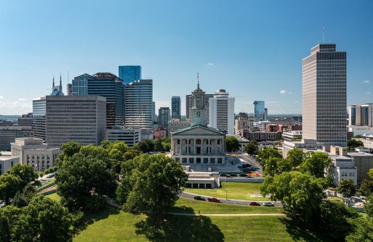 Aerial drone view of the Tennessee state capitol building in Nashville with the business district