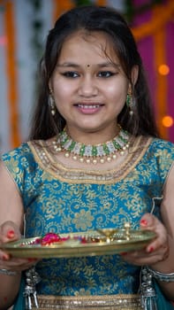 Indian children wearing ethnic Indian dress during Raksha Bandhan, a festival to celebrate the bond between brother-sister. Decoration in Indian houses.