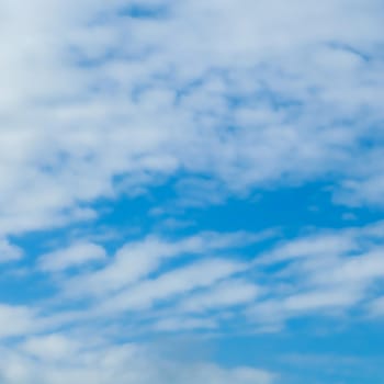 Background of blue sky with white clouds.