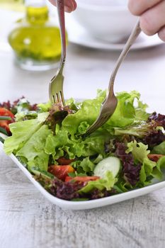 Vegetarian food. Detox vegetable salad - Lettuce, tomato, cucumber seasoned lemon-olive gravy. A dish for those who monitor their health 