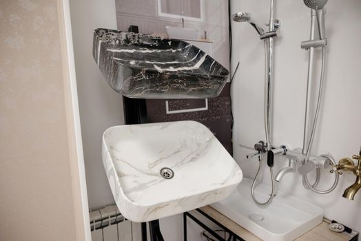 Sinks and faucets in a plumbing store.Sinks and faucets in a plumbing store.Large selection of sinks and faucets for home close-up