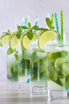 Refreshing infused water with cucumber, mint and lime. Summer drink cocktail lemonade. Healthy drink and detox concept