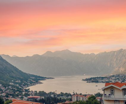 Sunset, beautiful landscape with silhouettes of trees. Travel concept. Montenegro, Kotor Bay. Sunset at Kotor Bay Montenegro. View of the sunset in Boko-Kotor Bay in Montenegro.