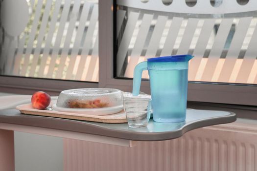 Food on a mobile tray in a modern hospital ward