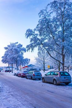 Bremerhaven Germany 18. December 2010 Amazing beautiful snowy winter snow and ice landscape panorama view with trees blue sky and town in Leherheide Bremerhaven Bremen Germany.