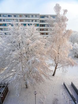 Amazing beautiful snowy winter snow and ice landscape panorama view with trees blue sky and town in Leherheide Bremerhaven Bremen Germany.