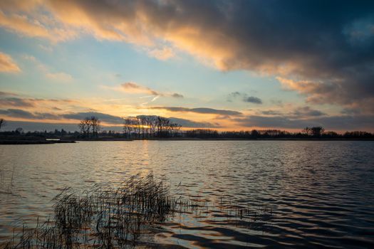 Moody view of a sunset over a lake, Stankow, Poland