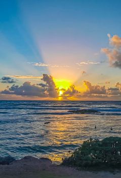 Amazing beautiful golden yellow colorful sunrise sunset with sunbeams at tropical beach with panorama view in Tulum Quintana Roo Mexico.