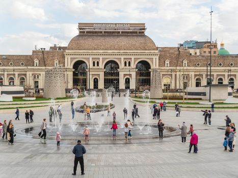 MOSCOW, RUSSIA - May 01, 2022. Tourists and local people walk on renovated Paveletskaya square near Paveletsky railway.