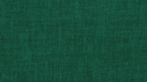 dark green cotton fabric texture useful as a background